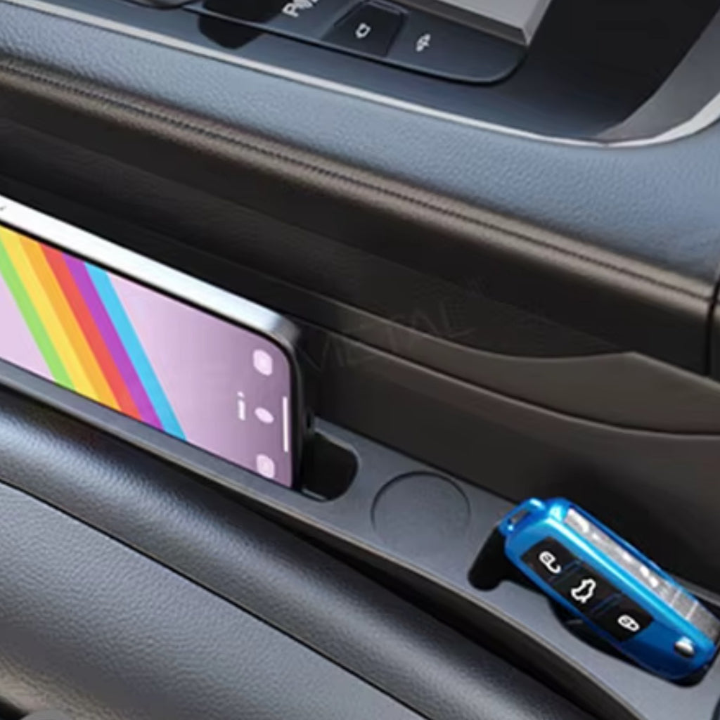 Seat gap filler holding a phone beside the seat