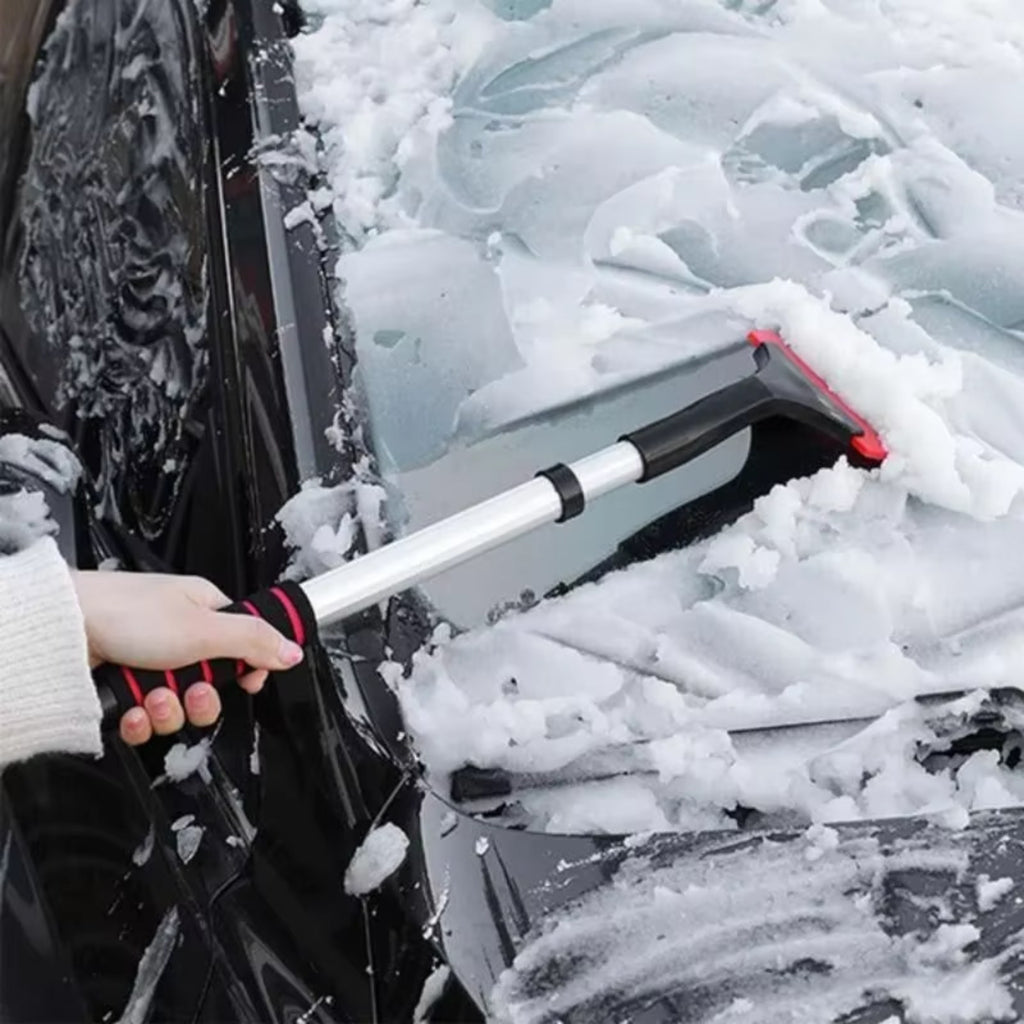 Scraping a snowy windshield