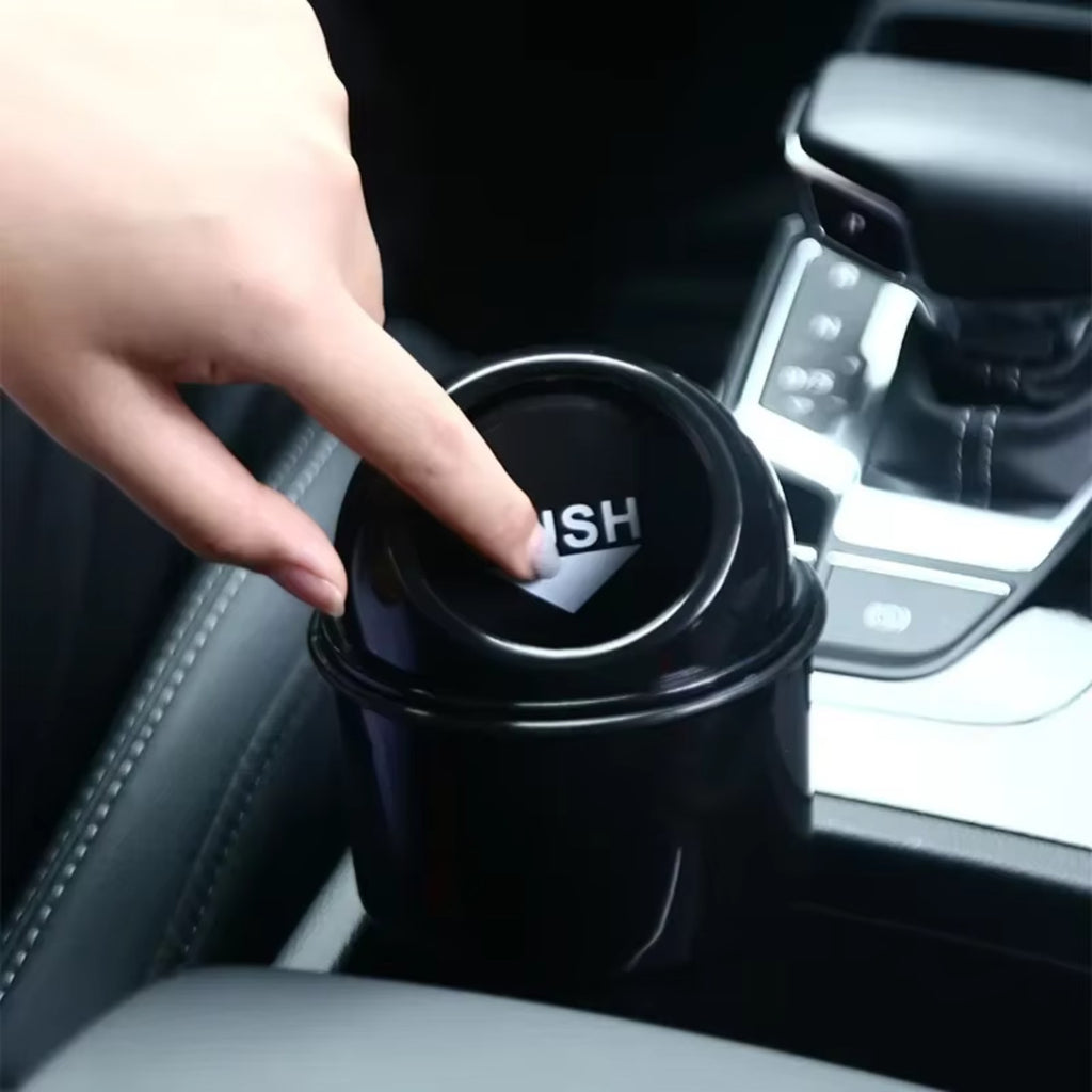 Pressing the lid on the trash can